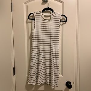 Black and white stripped tee shirt dress with mock neck and cut out in back.